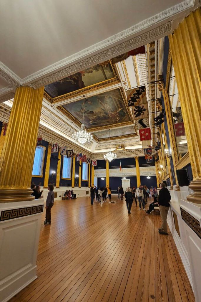 A picture of St Patrick's Hall in Dublin Castle with its gold columns and blue walls, the famous room in which the inauguration of the President of Ireland takes place.