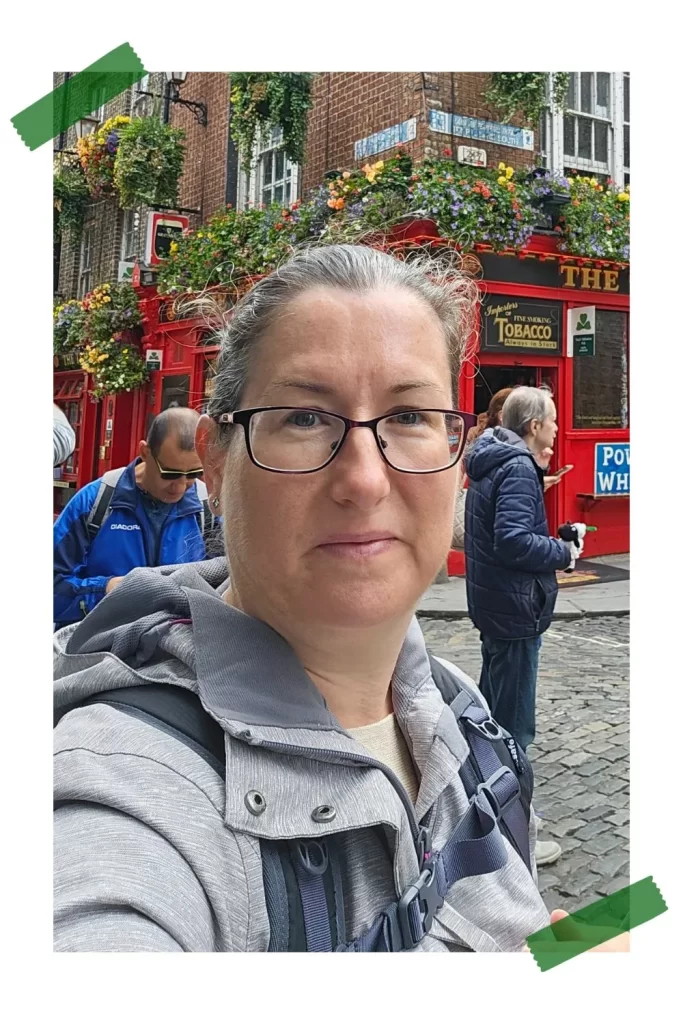 A picture of Cath Jordan, author of Travel Around Ireland, in front of the Temple Bar pub in Dublin, Ireland.