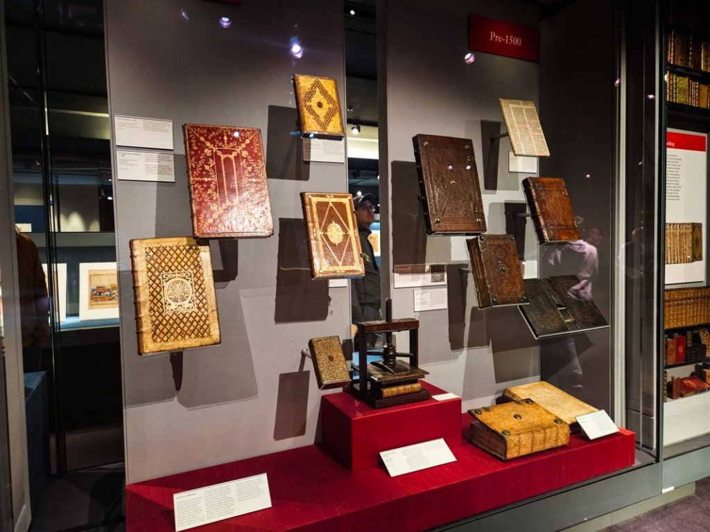 A display cabinet at the Chester Beatty Library in Dublin filled with religious books.