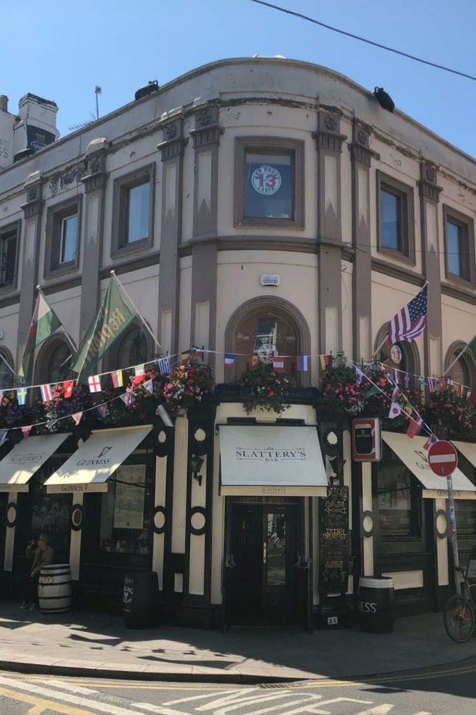 A picture of the exterior of Slattery's pub in Dublin with sunshine and blue skies overhead.