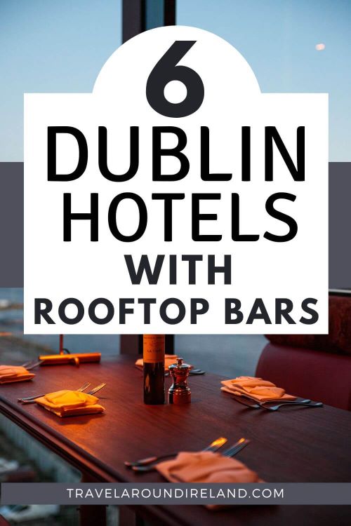 A picture of a table prepared for a meal beside a large window in a rooftop bar and text overlay saying 6 Dublin hotels with rooftop bars.