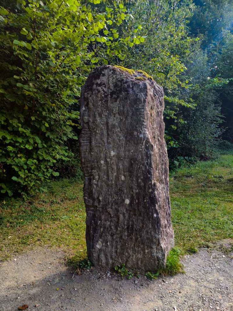 A picture of an Ogham Standing Stone in the Irish National Heritage Park in County Wexford.