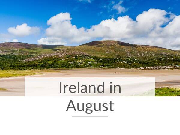 A picture of a beach in Ireland in the August sunshine and rolling green hills behind it and text overlay saying Ireland in August.