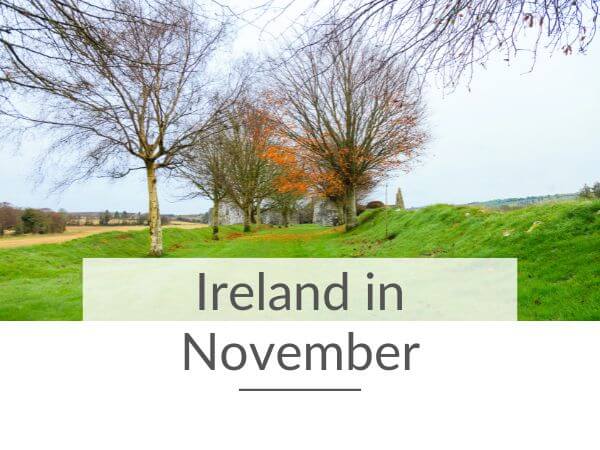 A picture of Kilcrea Castle in Cork through trees whose orange leaves are falling to the ground and text overlay saying Ireland in November.