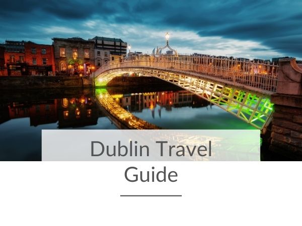 A picture of the Ha'Penny Bridge in Dublin by night and text overlay underneath saying Dublin travel guide.