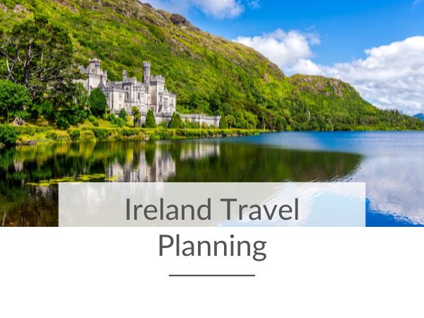 A picture of Kylemore Abbey in County Galway with blue skies over the lake and text overlay saying Ireland Travel Planning.
